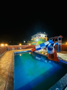 Nighttime view of the swimming pool at Sabo Resort